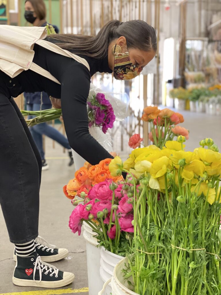 Nia Moore picking flowers at the flower market.